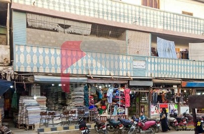 250 ( square yard ) building ( 23 shops & 8 flats ) for sale in Korangi Town, Karachi